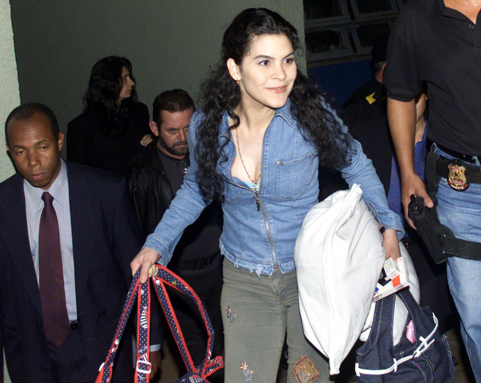 Backup singer of the former Mexican pop star [Gloria Trevi], Maria Raquenel Portillo leaves the hospital in Brasilia, March 31, 2003. [Raquenel, Trevi and the former manager Sergio Andrade were arrested on January 13, 2000 in Rio de Janeiro. Raquenel was sent back to Mexico on Monday to face Mexican authorities on charges of sexual abuse.]