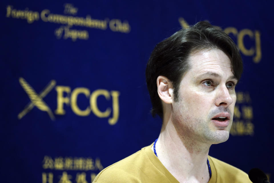 Tokyo-based Australian journalist Scott McIntyre speaks during a press conference at Foreign Correspondent's Club Japan in Tokyo Thursday, Jan. 16, 2020. McIntyre said he is a victim of “inhumane" custody laws that allow only one side of the parents access to children of broken marriages, the day after he was convicted of trespassing at the apartment building of his estranged wife's in-laws for trying to find his children. (AP Photo/Eugene Hoshiko)