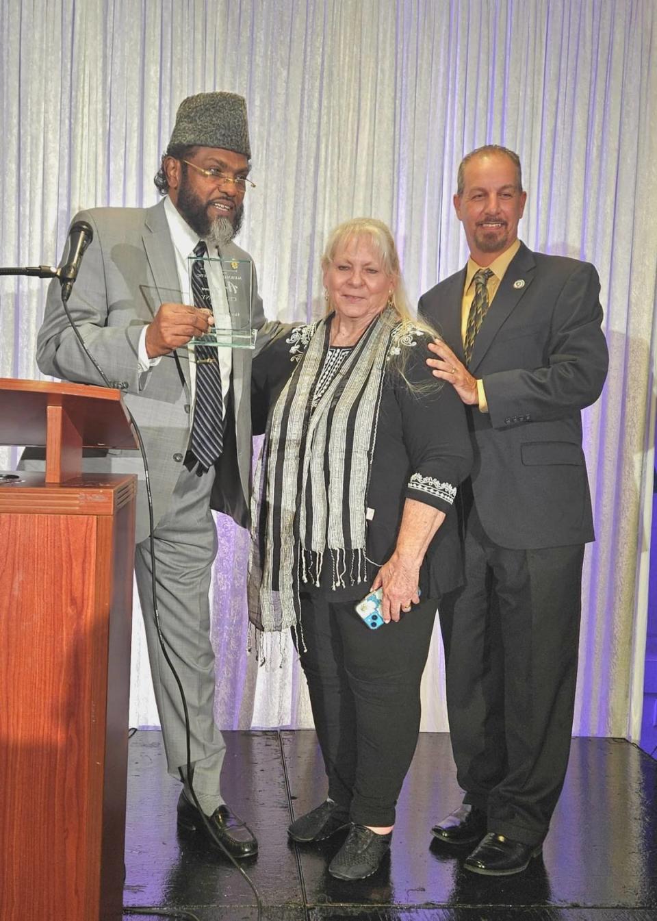 Shaikh Shafayat Mohamed, left, a South Florida Muslim leader and speaker, died in early June 2024. Shafayat poses for a photo with former Vice Mayor of Pembroke Pines Vice Iris Siple and Commissioner Jay D. Schwartz at an annual function at Darul Uloom Islamic Institute.