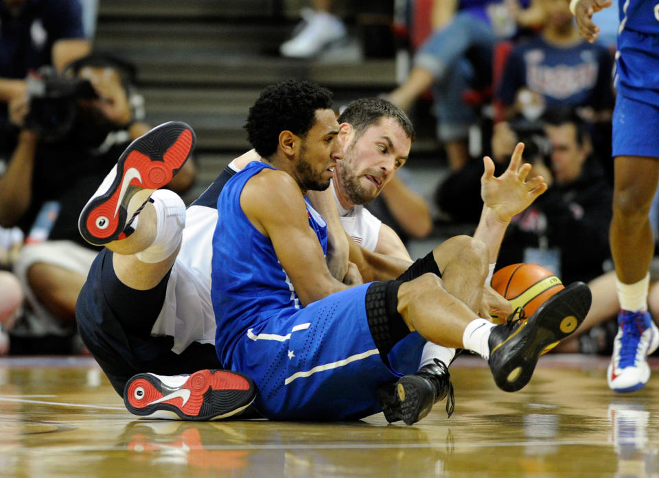 Kevin Love #11 of the US Men's Senior National Team and Edgar Sosa #4 of the Dominican Republic scramble for a loose ball during a pre-Olympic exhibition game at Thomas & Mack Center on July 12, 2012 in Las Vegas, Nevada. (Photo by David Becker/Getty Images)