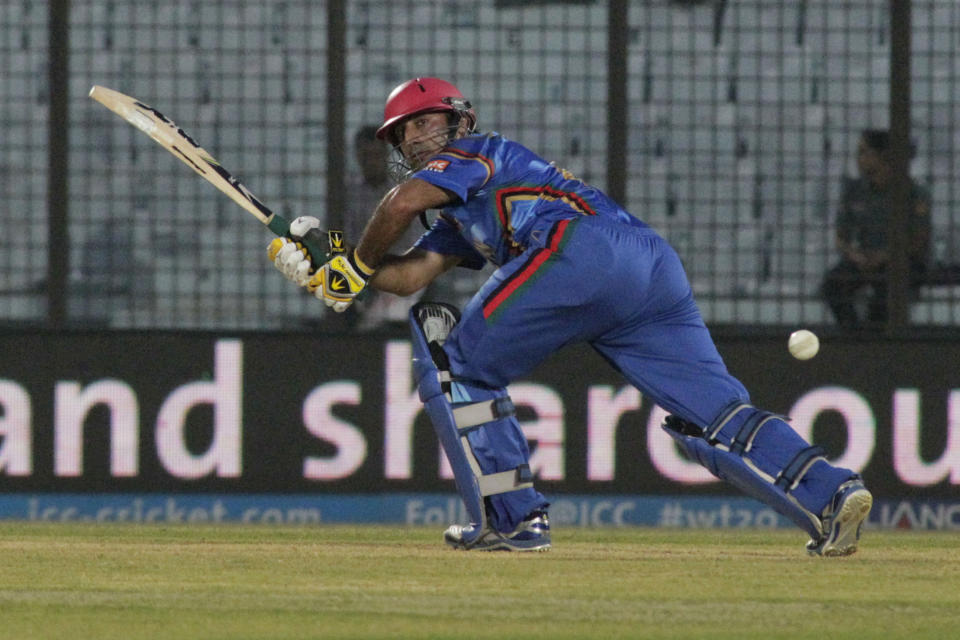 Afghanistan's Shafiqullah plays a shot during their ICC Twenty20 Cricket World Cup match against Nepal in Chittagong, Bangladesh, Thursday, March 20, 2014 . (AP Photo/Bikas Das)