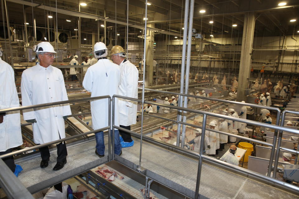 Officials tour the Greater Omaha Packing beef processing plant in Omaha, Neb., on Wednesday, Nov. 2, 2022. Greater Omaha is receiving a $20 million grant to expand its operations as part of a larger USDA program to expand meat processing capacity and encourage more competition in the highly concentrated business. (AP Photo/Josh Funk)