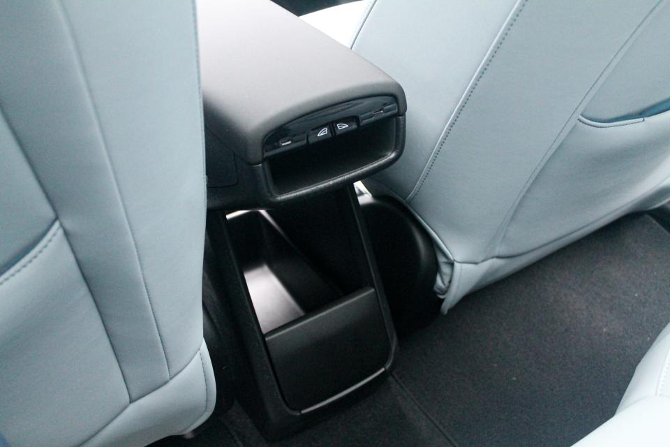 The back of the centre armrest in the Volvo EX30, which has several USB-C ports and window switches at the back.