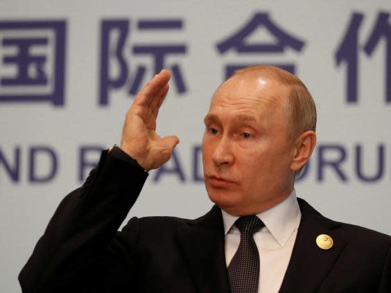 Vladimir Putin speaking at a news conference in Beijing, China, 27 April (REUTERS)