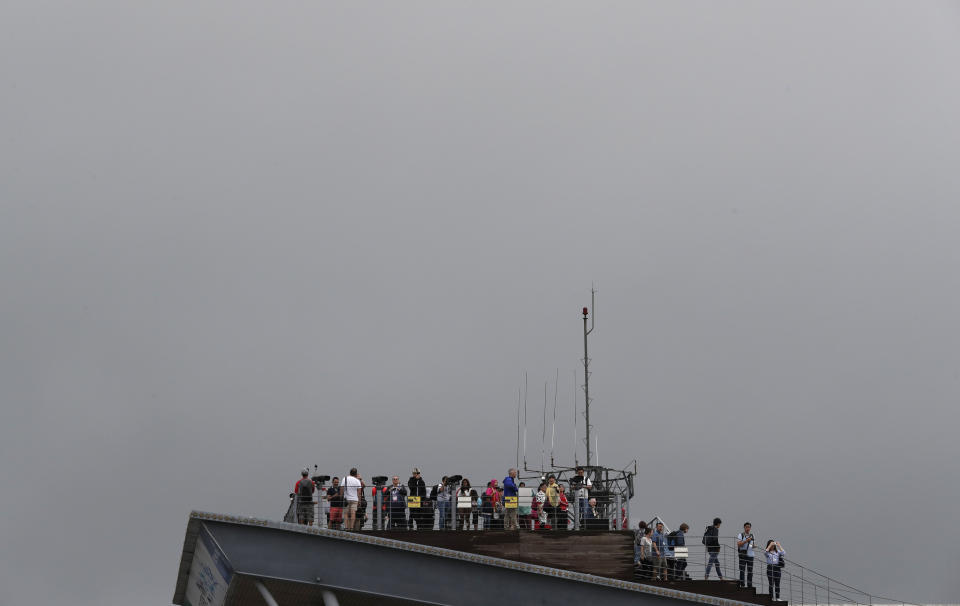 Visitors watch the north side from the Imjingak Pavilion in Paju, South Korea, Tuesday, Sept. 10, 2019. North Korea launched two projectiles toward the sea on Tuesday, South Korea's military said, hours after the North offered to resume nuclear diplomacy with the United States but warned its dealings with Washington may end without new U.S. proposals. (AP Photo/Lee Jin-man)