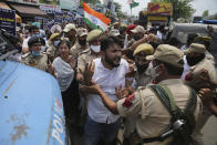 Members of National Students' Union of India scuffle with police during protest marking the second anniversary of Indian government scrapping Kashmir’s semi- autonomy in Jammu, India, Thursday, Aug. 5, 2021. On Aug. 5, 2019, Indian government passed legislation in Parliament that stripped Jammu and Kashmir’s statehood, scrapped its separate constitution and removed inherited protections on land and jobs. (AP Photo/Channi Anand)