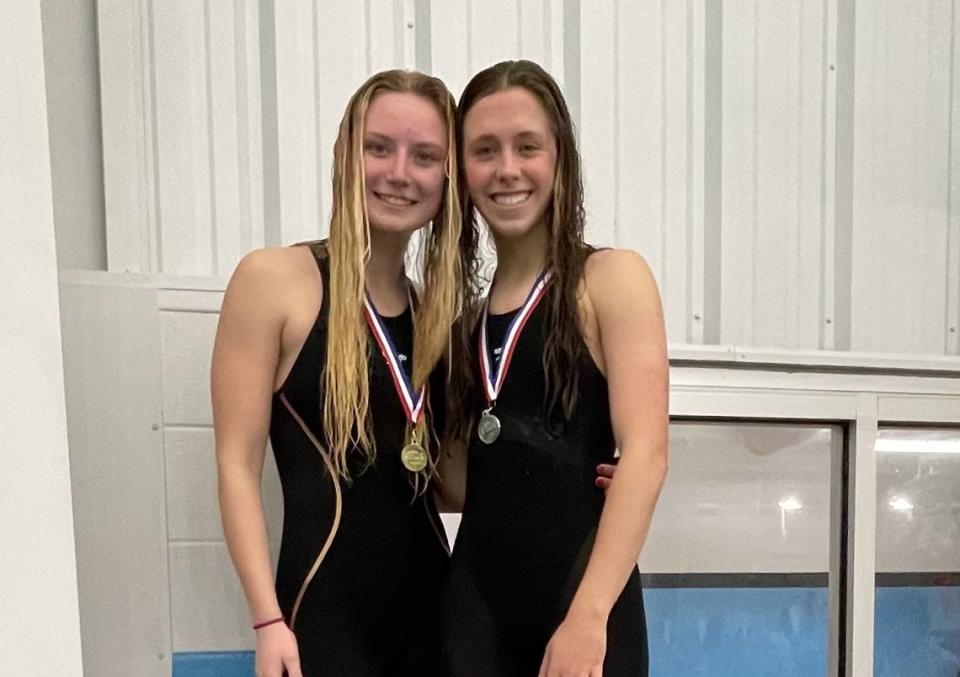 Lexington Catholic’s Lillian Hosinskin, left, and Caroline Beiting each got an individual win in the Region 8 Swimming Championships on Saturday at Stivers Aquatic Center in Barbourville. Photo provided