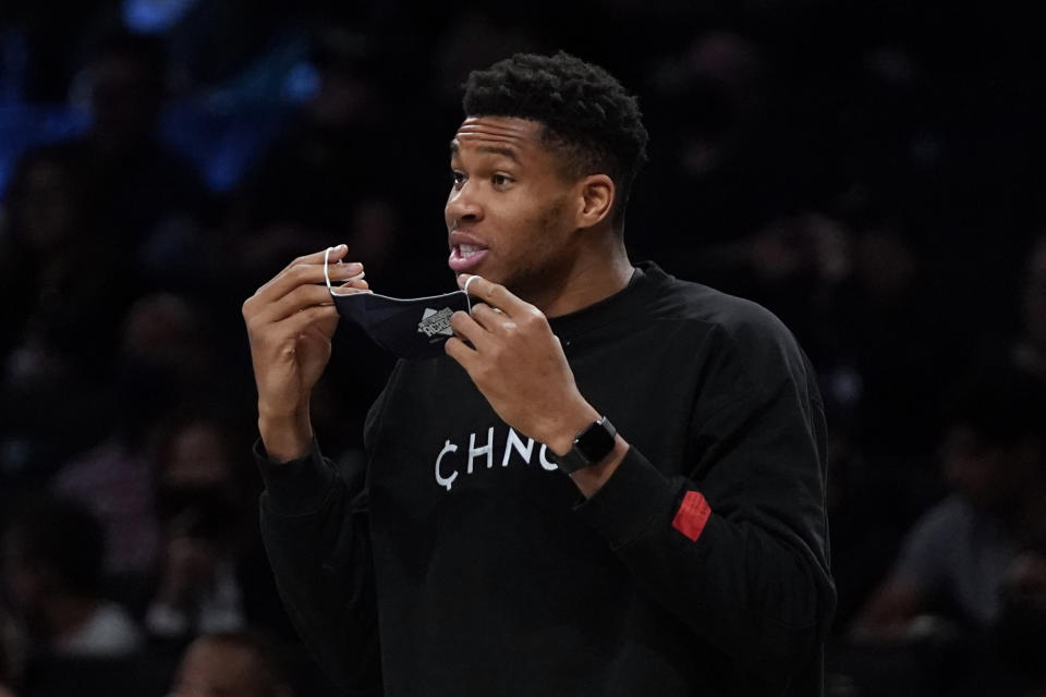 Milwaukee Bucks' Giannis Antetokounmpo calls out to his teammates during the first half of a preseason NBA basketball game against the Brooklyn Nets on Friday, Oct. 8, 2021, in New York. (AP Photo/Frank Franklin II)