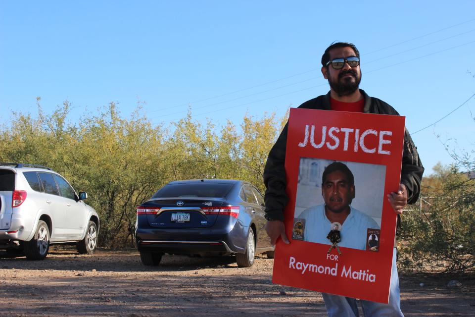 The family of Raymond Mattia and attendees gather outside of the Tohono O'odham Nation Police Department in Sells, Arizona, for a peaceful protest calling for more accountability from the department on Friday, December 15, 2023.