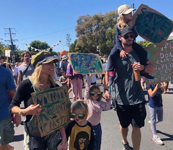 Chris Hemsworth and Elsa Pataky with their children at a climate strike rally in Byron Bay.