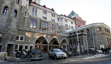 People walk past Badrutt's Palace Hotel in the Swiss mountain resort of St. Moritz in this January 24, 2008 file photo. REUTERS/ Arnd Wiegmann/Files