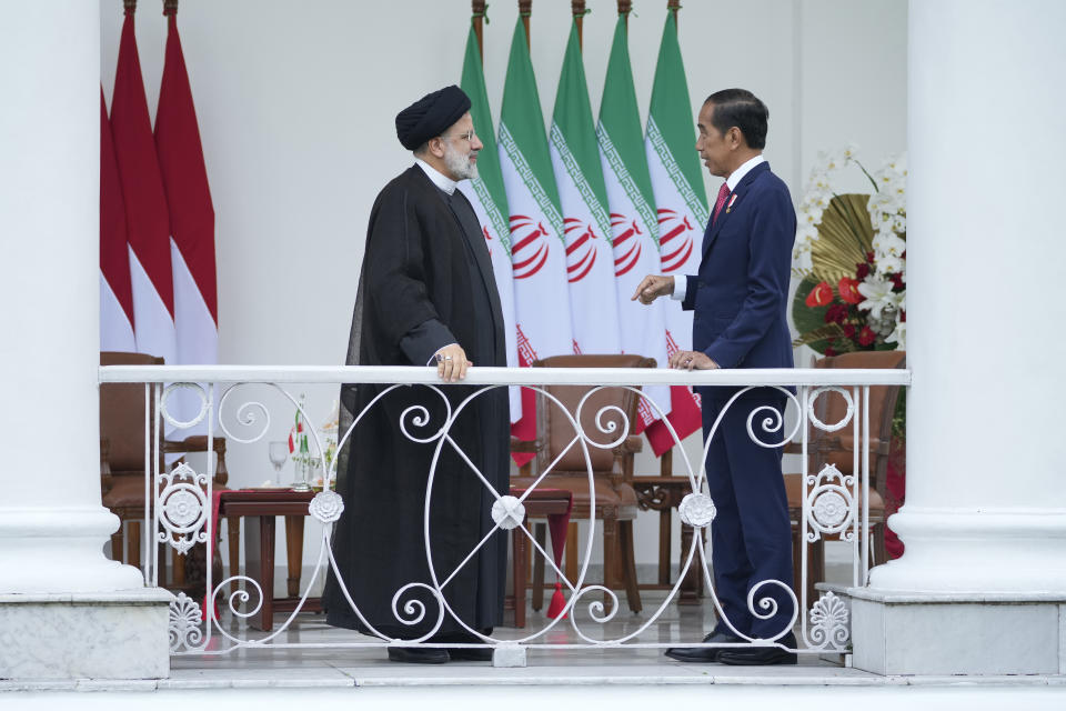 Iran's President Ebrahim Raisi, left, talks to Indonesian President Joko Widodo during their meeting at the Presidential Palace in Bogor, West Java, Indonesia, Tuesday, May 23, 2023.(AP Photo/Achmad Ibrahim)