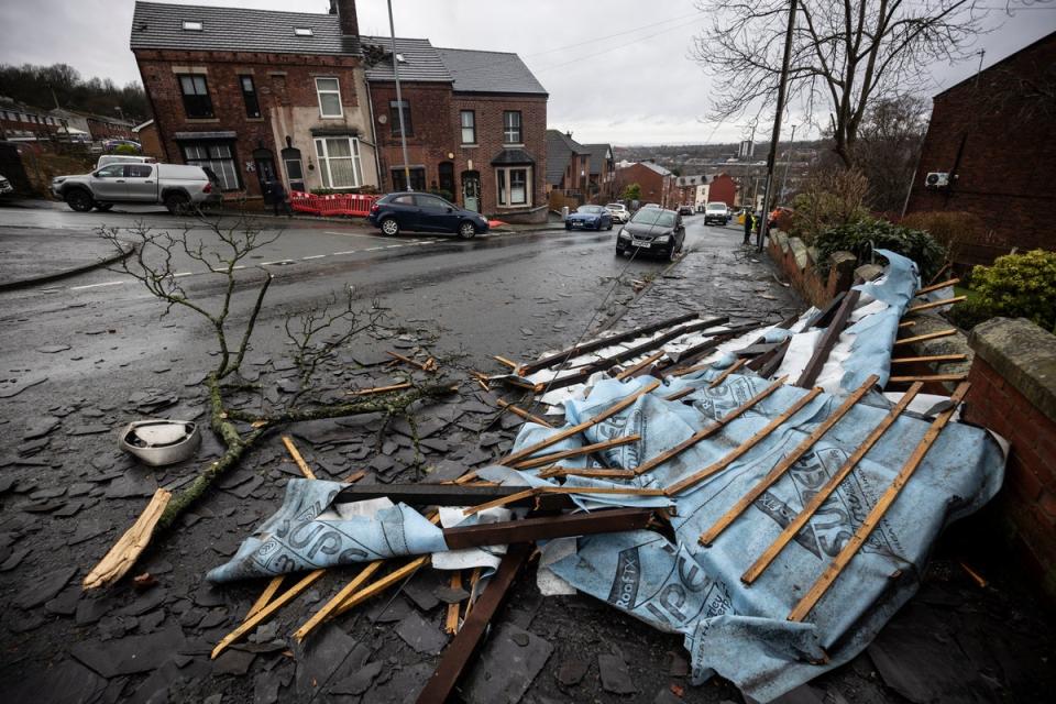 Part of a fallen roof lays on the floor following the suspected tornado in Stalybridge (Getty)