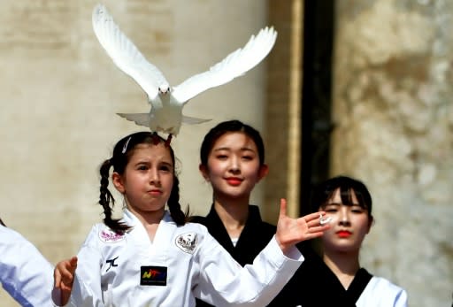 A Korean girl released a dove as a sign of peace