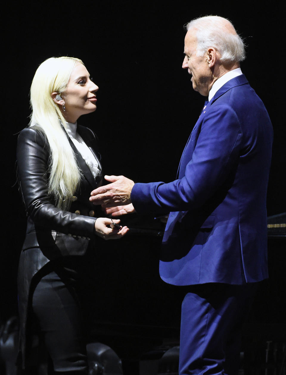 Lady Gaga (L) is greeted by Joe Biden after she performed for students as part of the national It's On Us Week of Action at the Cox Pavilion at UNLV on April 7, 2016 in Las Vegas, Nevada.  (Photo by Ethan Miller/Getty Images)
