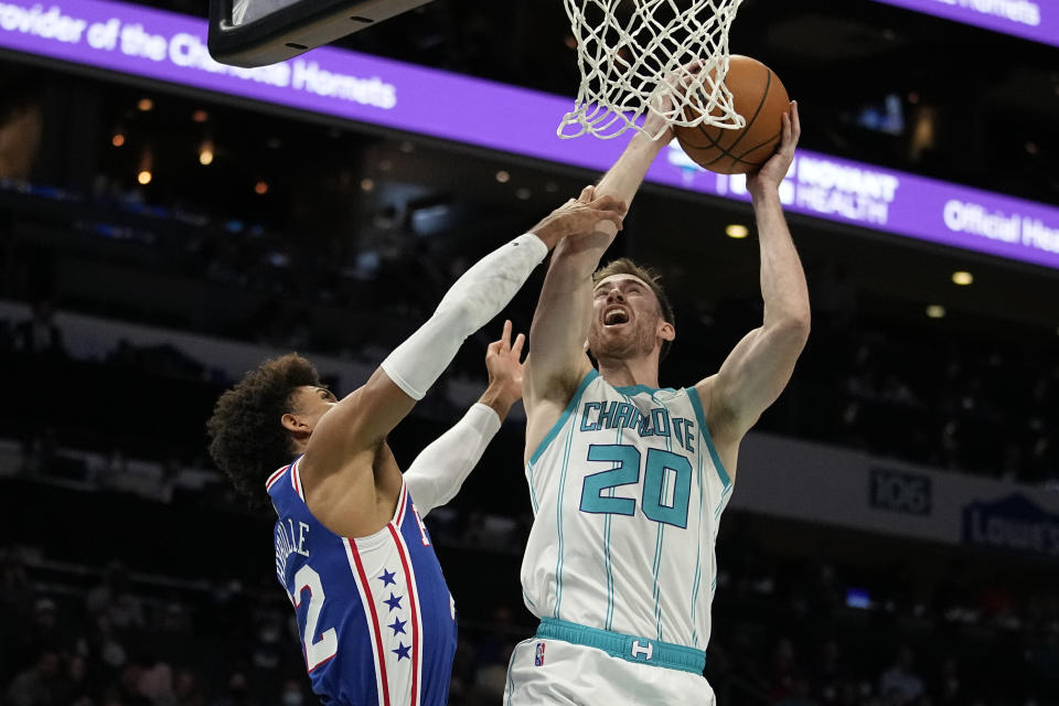 Charlotte Hornets forward Gordon Hayward shoots over Philadelphia 76ers guard Matisse Thybulle during the first half of an NBA basketball game on Monday, Dec. 6, 2021, in Charlotte, N.C. (AP Photo/Chris Carlson)