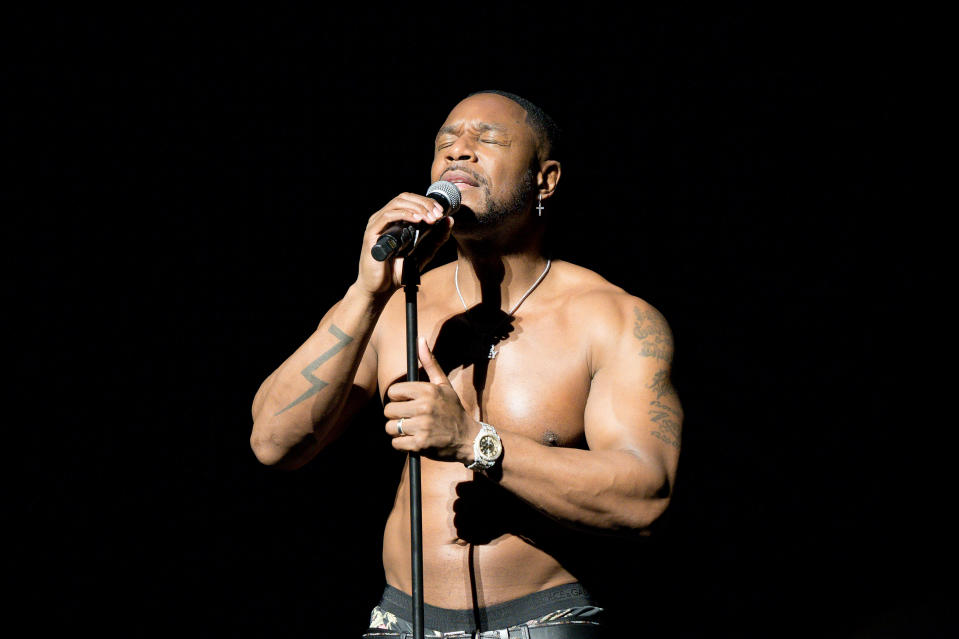 Tank shirtless onstage