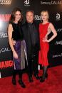 <b>Dakota Johnson Upstages Famous Father<br><br></b>Dakota Johnson, far right, poses alongside her dad Don Johnson and his wife Kelley Phleger on Tuesday in New York for the premiere of "Django Unchained." <br><br>Wearing a bold red, sleeveless dress with a nude, sheer back panel, Johnson finished the look with a soft ponytail, matching red lip and holiday-chic black hose with patent leather Mary Jane heels. <br><br><br> (Photo by Stephen Lovekin/Getty Images)