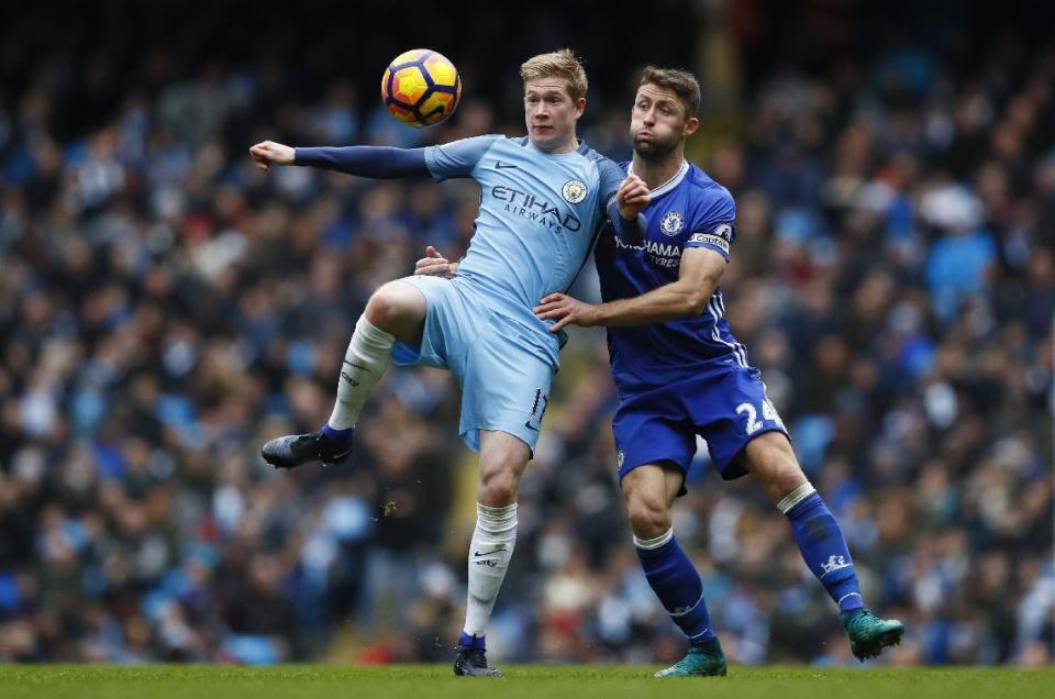 Britain Football Soccer - Manchester City v Chelsea - Premier League - Etihad Stadium - 3/12/16 Manchester City's Kevin De Bruyne in action with Chelsea's Gary Cahill Action Images via Reuters / Jason Cairnduff Livepic EDITORIAL USE ONLY. No use with unauthorized audio, video, data, fixture lists, club/league logos or "live" services. Online in-match use limited to 45 images, no video emulation. No use in betting, games or single club/league/player publications. Please contact your account representative for further details.