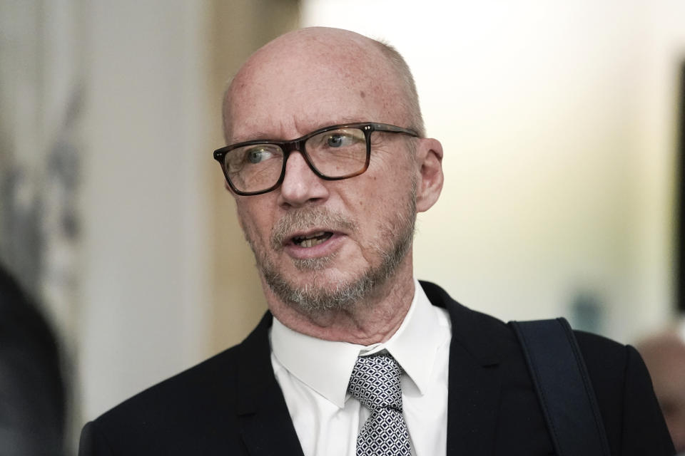 Film director Paul Haggis exits the courtroom for a lunch break, Wednesday, Oct. 19, 2022, in New York. Jurors are getting their first look at a lawsuit that pits Oscar-winning moviemaker Haggis against a publicist who alleges that he raped her. He says their 2013 encounter was consensual. (AP Photo/Julia Nikhinson)