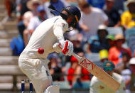 Cricket - Ashes test match - Australia v England - WACA Ground, Perth, Australia, December 14, 2017. England's Mark Stoneman is hit by a short delivery from Australia's Josh Hazlewood during the first day of the third Ashes cricket test match. REUTERS/David Gray