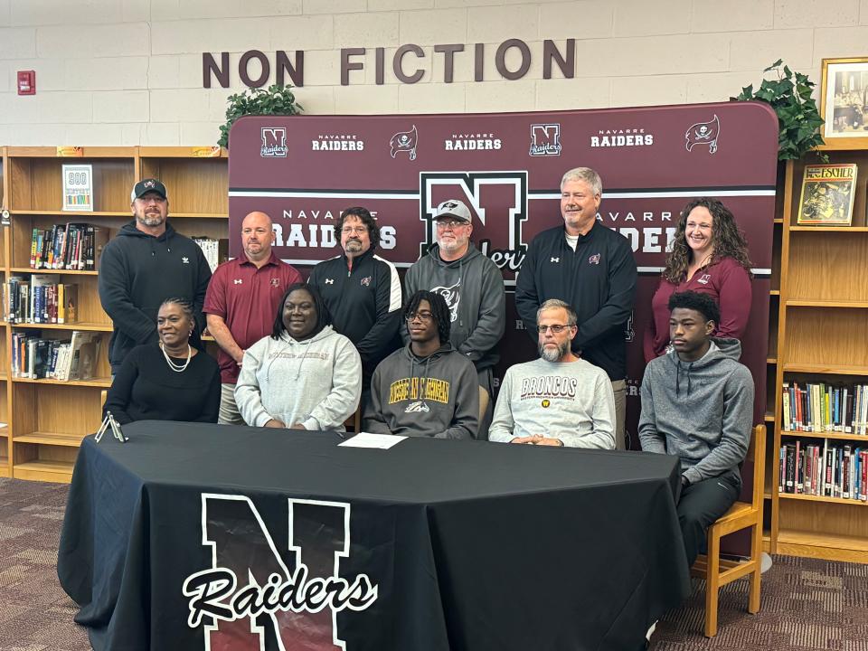 Navarre's Terence Marshall (middle, front row) signed his letter of intent to play college football at Western Michigan University next year. Marshall signed the LOI on Wednesday, Dec. 20, 2023.