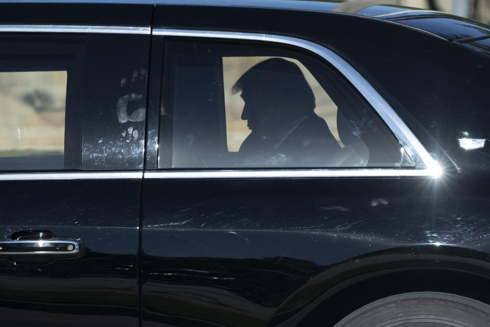 FILE - In this June 11, 2020, file photo President Donald Trump rides in his limousine as he departs after speaking during a roundtable discussion about "Transition to Greatness: Restoring, Rebuilding, and Renewing," at Gateway Church Dallas in Dallas. (AP Photo/Alex Brandon, File)