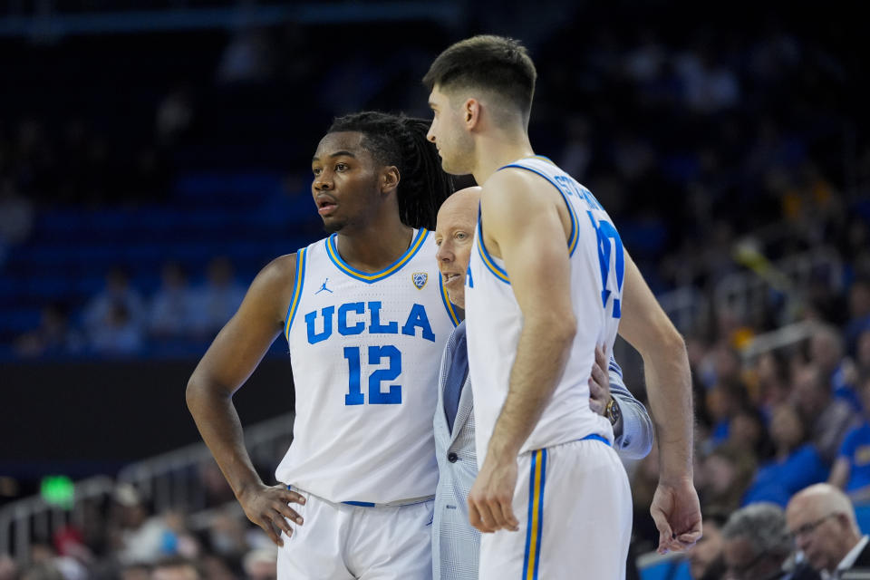 UCLA coach Mick Cronin talks with guard Sebastian Mack (12) and guard Lazar Stefanovic (10) during the second half of the team's NCAA college basketball game against Arizona State in Los Angeles, Saturday, March 9, 2024. UCLA won 59-47. (AP Photo/Jae C. Hong)
