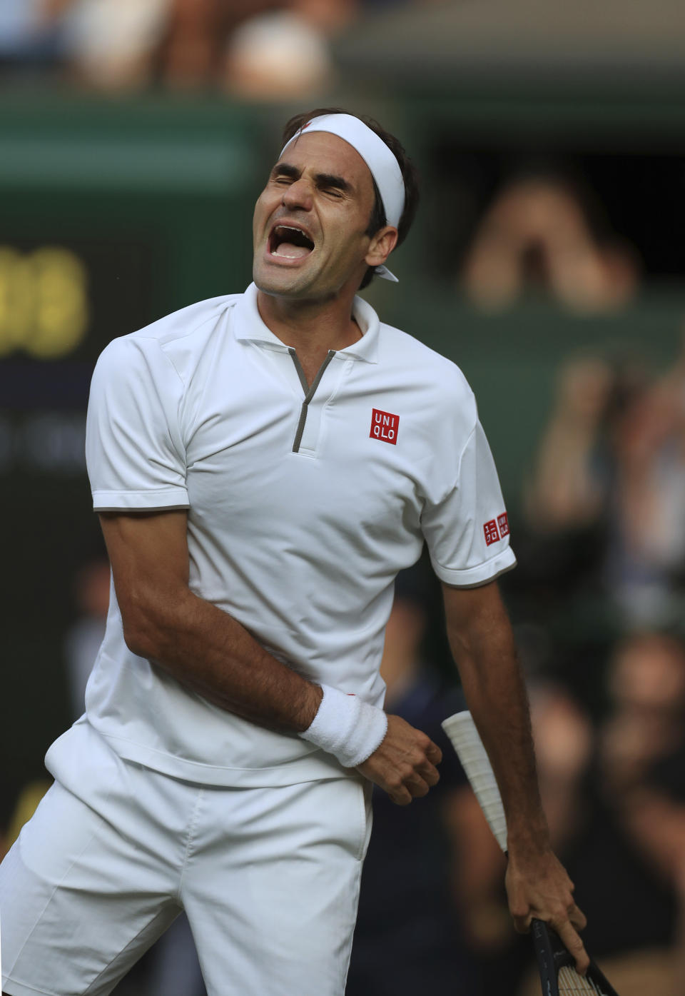 Switzerland's Roger Federer celebrates after beating Spain's Rafael Nadal in a Men's singles semifinal match on day eleven of the Wimbledon Tennis Championships in London, Friday, July 12, 2019. (Mike Egerton/Pool Photo via AP)