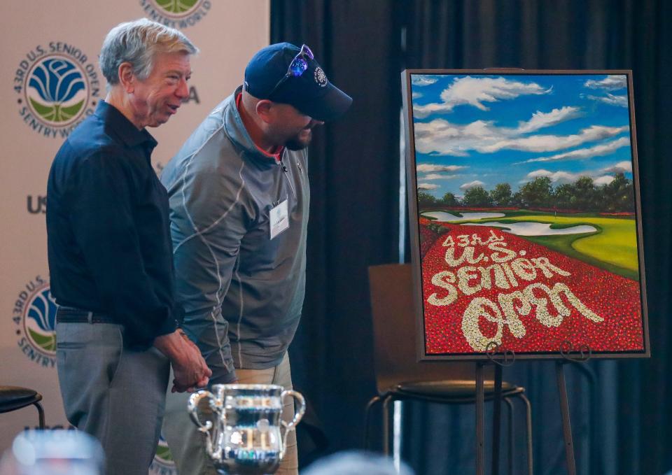 Sentry Insurance President and CEO Pete McPartland and Janesville Parker High School Golf Coach Sam Van Galder unveil Van Galder’s commemorative painting during the 2023 U.S. Senior Open media day on May 15 at SentryWorld in Stevens Point. SentryWorld will host the tournament from June 29 to July 2.