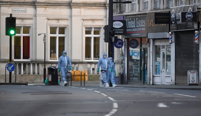 Police forensic officers are seen near the site where a man was shot by armed officers in Streatham, south London