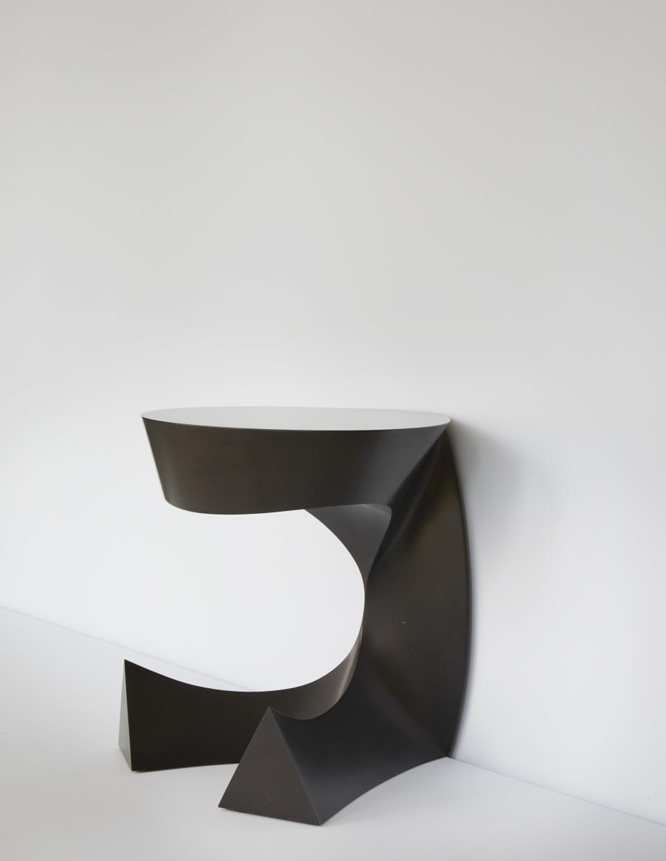 Bakker's Sitting Table is made out of Noir Belge de Mazy marble.