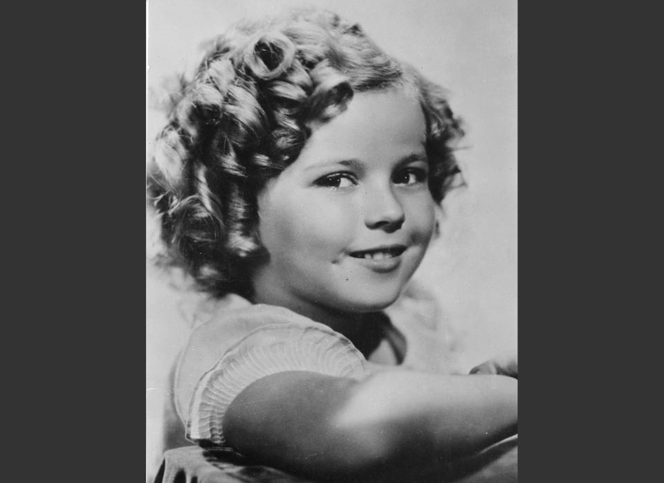 FILE - In this November 1936 file photo, 8-year-old U.S. American child movie star Shirley Temple is portrayed in Hollywood, Calif. Shirley Temple, the curly-haired child star who put smiles on the faces of Depression-era moviegoers, has died. She was 85. Publicist Cheryl Kagan says Temple, known in private life as Shirley Temple Black, died Monday night, Feb. 10, 2014, surrounded by family at her home near San Francisco. (AP Photo/File)