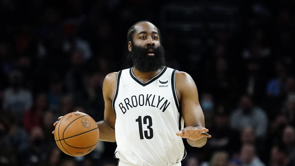 Brooklyn Nets guard James Harden (13) looks to pass against the Phoenix Suns during the first half of an NBA basketball game, Tuesday, Feb. 1, 2022, in Phoenix. (AP Photo/Matt York)