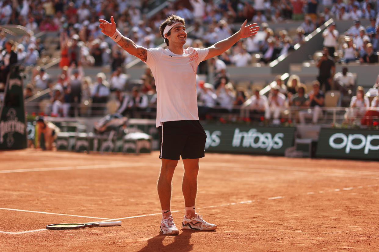 Brazil's Thiago Seyboth Wild celebrates his win over Daniil Medvedev in the first round of the French Open on May 30, 2023 in Paris, France. (Photo by Julian Finney/Getty Images)