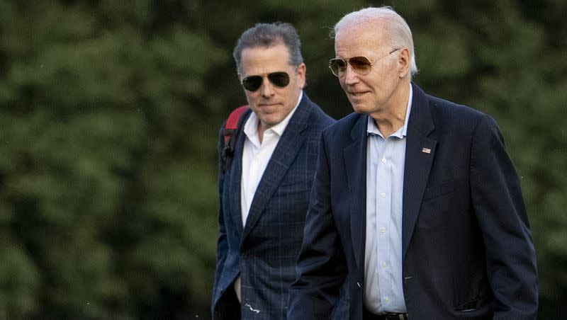 President Joe Biden, left, and his son, Hunter Biden, arrive at Fort McNair, Sunday, June 25, 2023, in Washington. The Bidens were returning from Camp David.