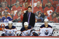 Edmonton Oilers coach Jay Woodcroft watches play during the third period of Game 1 of the team's NHL hockey second-round playoff series against the Calgary Flames on Wednesday, May 18, 2022, in Calgary, Alberta. (Jeff McIntosh/The Canadian Press via AP)