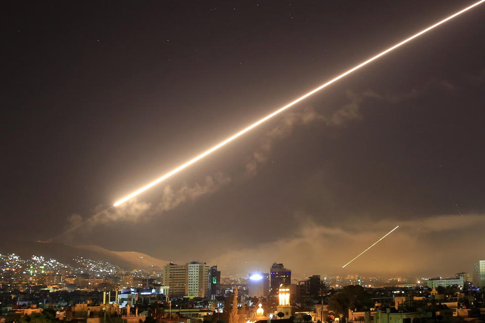 <p>Damascus skies erupt with surface to air missile fire as the U.S. launches an attack on Syria targeting different parts of the Syrian capital Damascus, Syria, early Saturday, April 14, 2018. (Photo: Hassan Ammar/AP) </p>