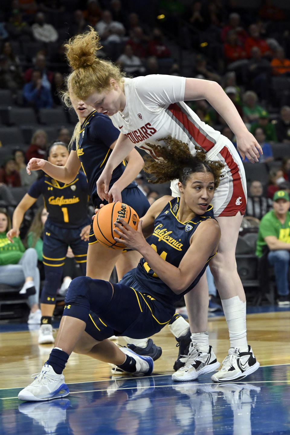 California forward Evelien Lutje Schipholt (24) falls to the court against Washington State center Jessica Clarke during the second half of an NCAA college basketball game in the first round of the Pac-12 women's tournament Wednesday, March 1, 2023, in Las Vegas. (AP Photo/David Becker)