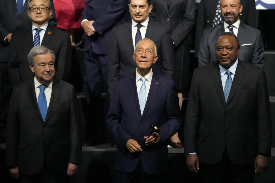 From left, United Nations Secretary-General Antonio Guterres, Portuguese President Marcelo Rebelo de Sousa, and Kenyan President Uhuru Kenyatta take part in a group photo at the United Nations Ocean Conference in Lisbon, Monday, June 27, 2022. From June 27 to July 1, the United Nations is holding its Oceans Conference in Lisbon expecting to bring fresh momentum for efforts to find an international agreement on protecting the world's oceans. (AP Photo/Armando Franca)