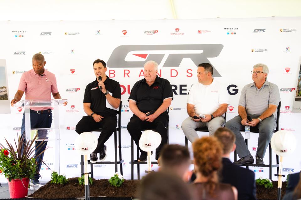 Graham Rahal (pictured level), the owner of his Graham Rahal Brands company that includes Ducati and Piaggio dealerships and a high-performance car restoration shop, speaks Wednesday and the groundbreaking ceremony for GRB's new headquarters in Zionsville.