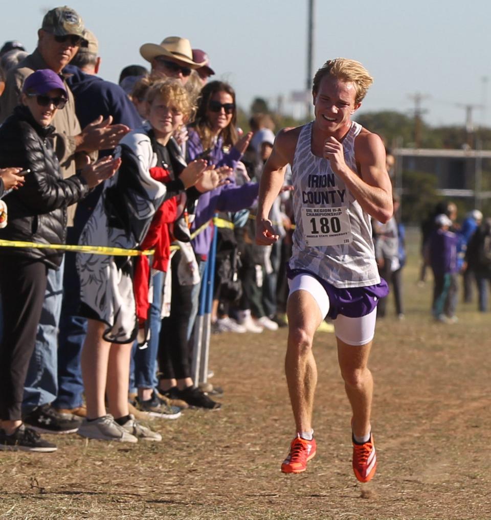 Irion County High School's Tayte Cormier runs hard toward the finish line despite being almost a full minute ahead of the second-place runner to win the boys division title at the Region II-1A Cross Country Championships Tuesday, Oct. 25, 2022, at the Angelo State University Intramural Fields.