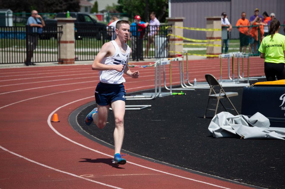 Hillsdale Academy senior Emil Schlueter takes first place in the 3200-meter run.