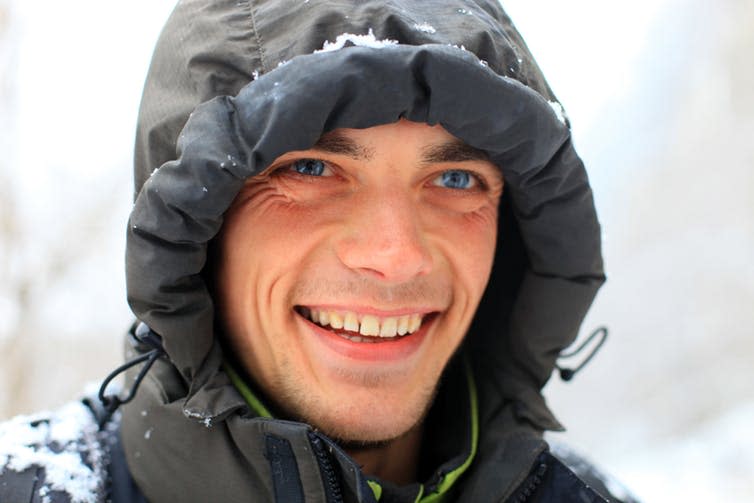 <span class="caption">Blue eyes may have evolved to help us absorb more vitamin D during winter months.</span> <span class="attribution"><a class="link " href="https://www.shutterstock.com/image-photo/closeup-portrait-smiling-young-man-85330090?src=0IO5ysSvfukaAkNW1zy2pQ-1-13" rel="nofollow noopener" target="_blank" data-ylk="slk:Photobac/Shutterstock;elm:context_link;itc:0;sec:content-canvas">Photobac/Shutterstock</a></span>