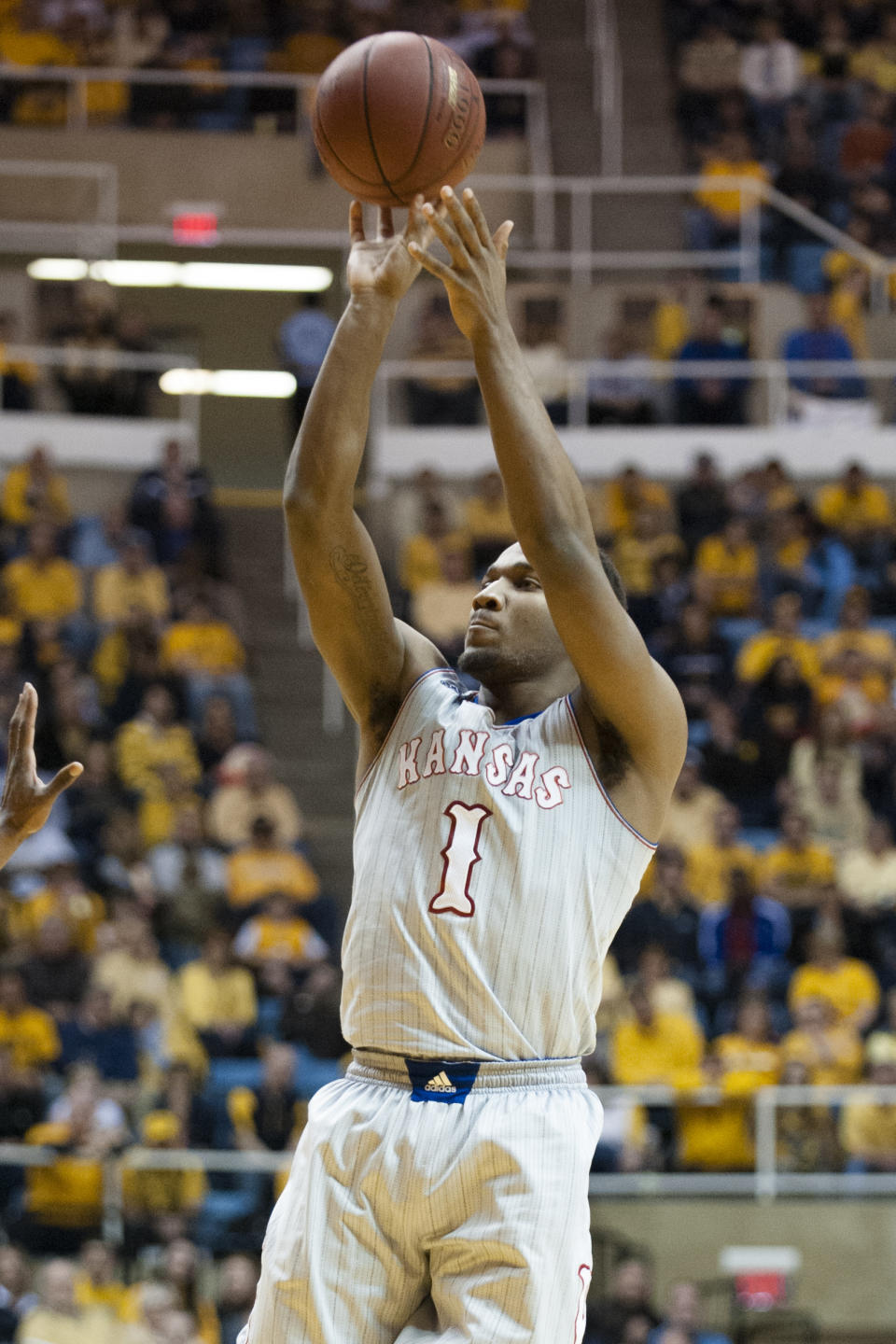 Kansas' Wayne Selden, Jr. (1) shoots during the first half of an NCAA college basketball game against West Virginia, Saturday, March 8, 2014, in Morgantown, W.Va. (AP Photo/Andrew Ferguson)