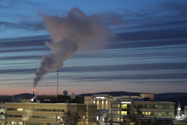 FILE - A plume of smoke being emitted into the air from a power plant, Feb. 16, 2022, in Fairbanks, Alaska. The Biden administration is proposing new limits on greenhouse gas emissions from coal- and gas-fired power plants, its most ambitious effort yet to reduce planet-warming pollution from the nation’s second-largest contributor to climate change. A rule being unveiled Thursday by the Environmental Protection Agency could force power plants to capture smokestack emissions using technology that isn't in widespread use in the U.S. (AP Photo/Mark Thiessen, File)