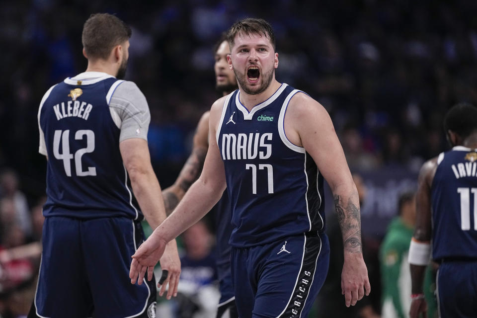 Dallas Mavericks guard Luka Doncic reacts after a play against the Boston Celtics during the second half in Game 3 of the NBA basketball finals, Wednesday, June 12, 2024, in Dallas. (AP Photo/Tony Gutierrez)