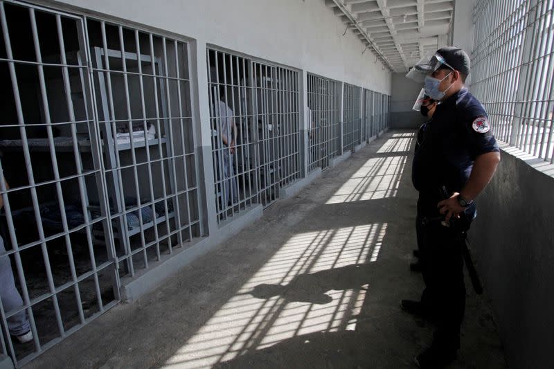 FILE PHOTO: Police officers stand guard during a roll call of inmates at the Apodaca prison in the municipality of Apodaca