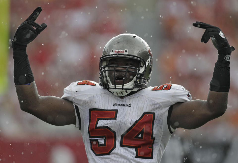 FILE - Tampa Bay Buccaneers linebacker Geno Hayes (54) gestures during an NFL football game against the Cleveland Browns in Tampa, Fla., in this Sunday, Sept. 12, 2010, file photo. Hayes, a former NFL linebacker who starred at Florida State, has died. He was 33. The Tampa Bay Buccaneers on Tuesday, April 27, 2021, confirmed his death. He had liver disease and had been in hospice care. (AP Photo/Chris O'Meara, File)