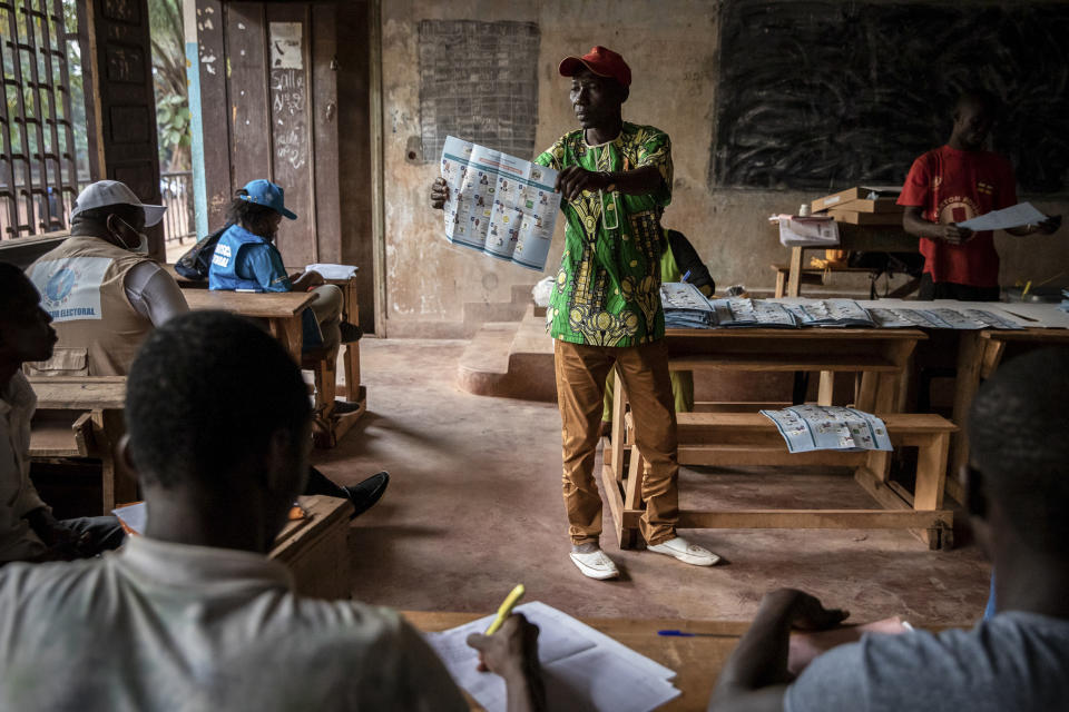 Electoral workers start to count votes at the Lycée Boganda polling station in the capital Bangui, Central African Republic, Sunday, Dec. 27, 2020. The country held presidential and legislative elections Sunday amid fears of violence after a campaign period marked by fighting between rebels and government forces, and while voters came out in large numbers in the capital, in other parts of the country fewer people went to polling stations because of fears of violence or boycotts by the rebel coalition. (AP Photo)